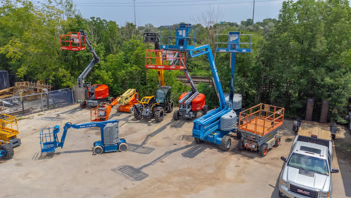 boom lifts cherry pickers on a yard