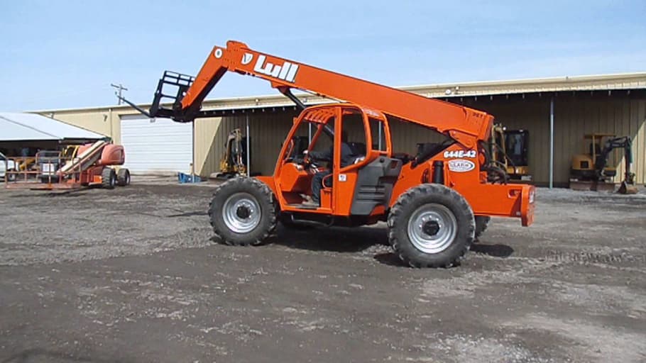 Material handler in front of a warehouse
